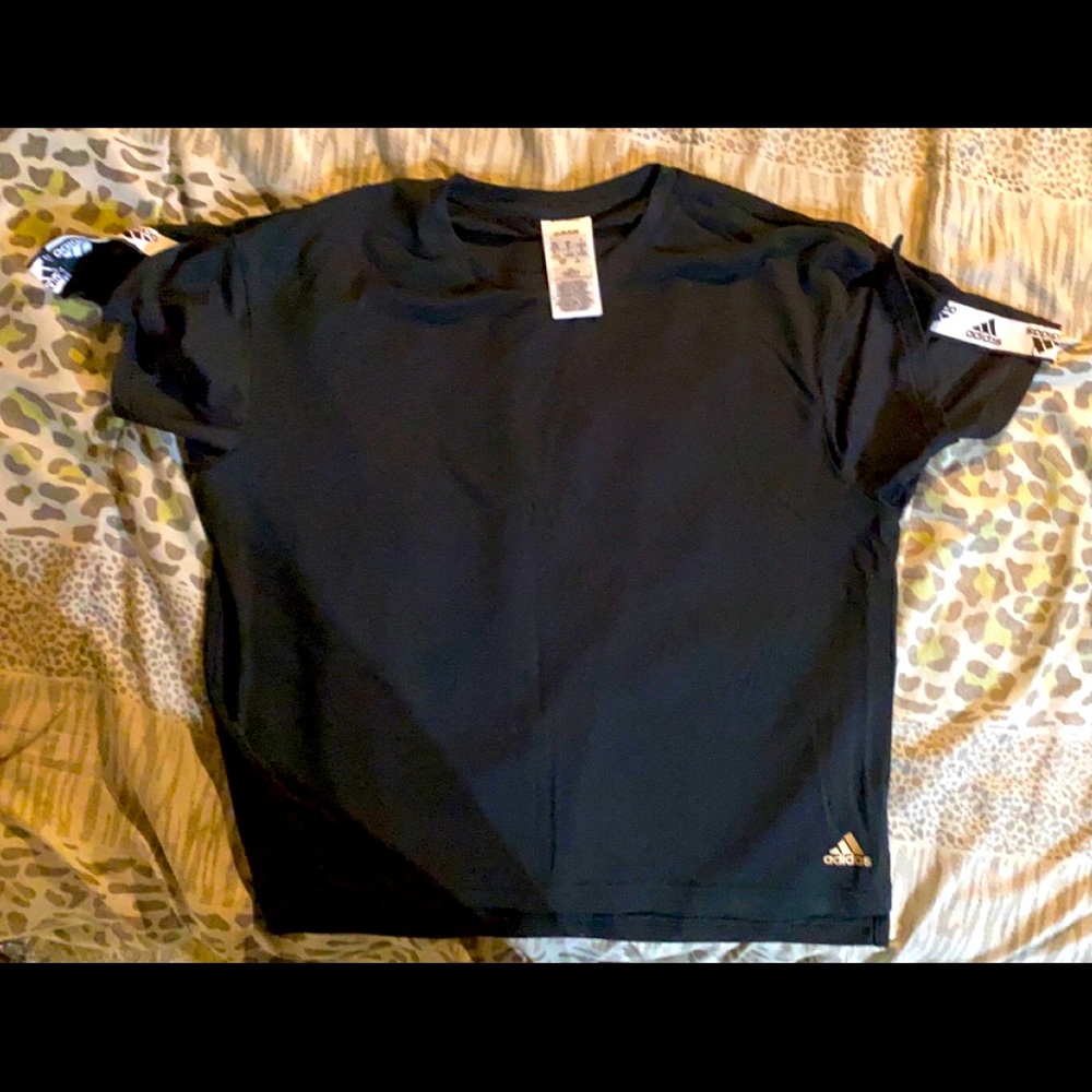 adidas top-never worn. Can fit size S/Med. Smoke and pet free home